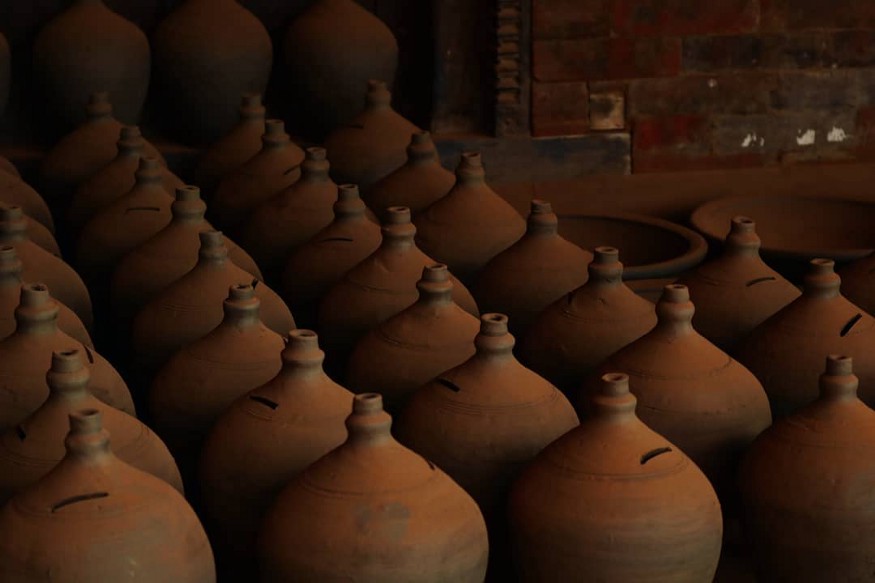 A collection of pots made from mud.
