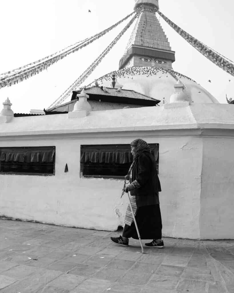 A-Buddhist-walks-around-in-Boudhanath-Temple