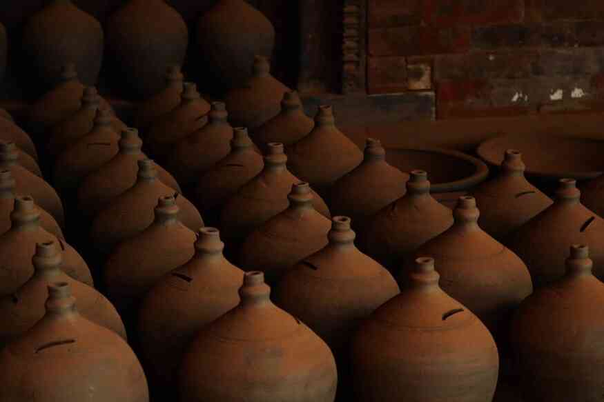 a collection of pots made from mud