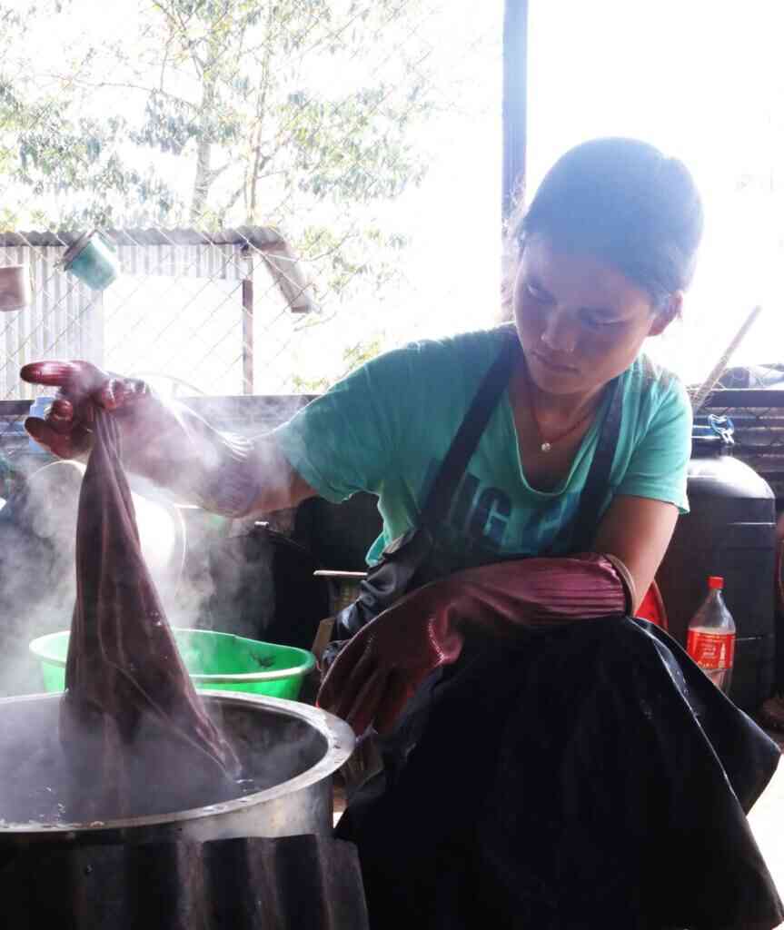 a woman dyeing fabric for samsara